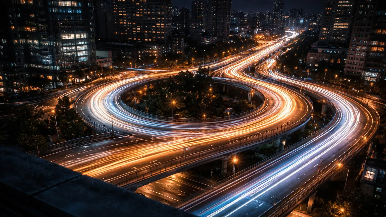Long exposure circular motion of city lights at night, symbolizing an ongoing feedback loop in futures journaling